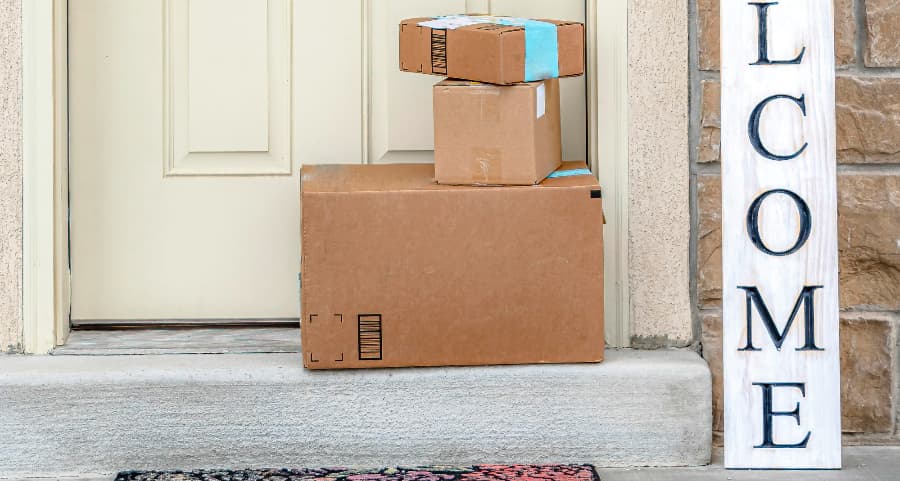 Deliveries on the front porch of a house with a welcome sign in Salt Lake City